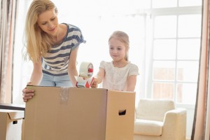 Mother and daughter with moving box